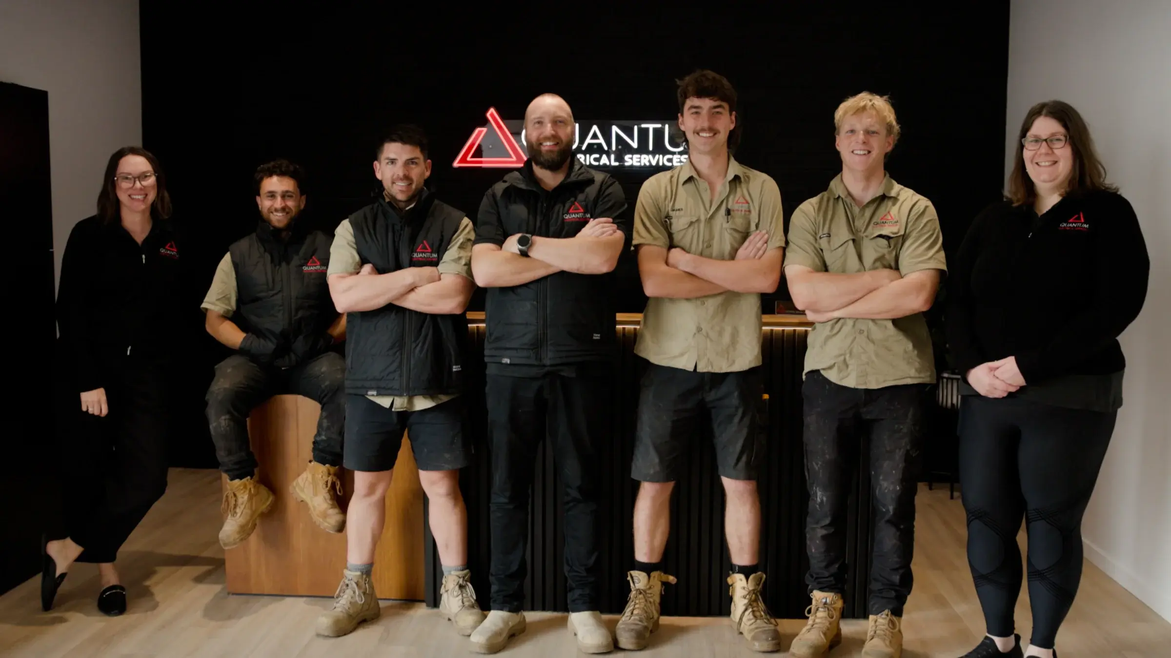 Quantum Electrical team members standing together in Perth Hills bushland
